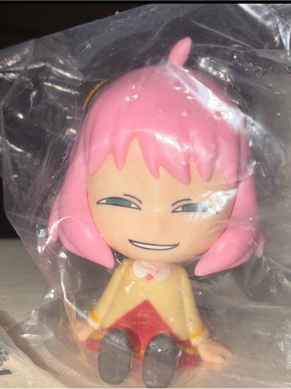 Pink-Haired Figure Sitting Character Toy - Cute Collectible